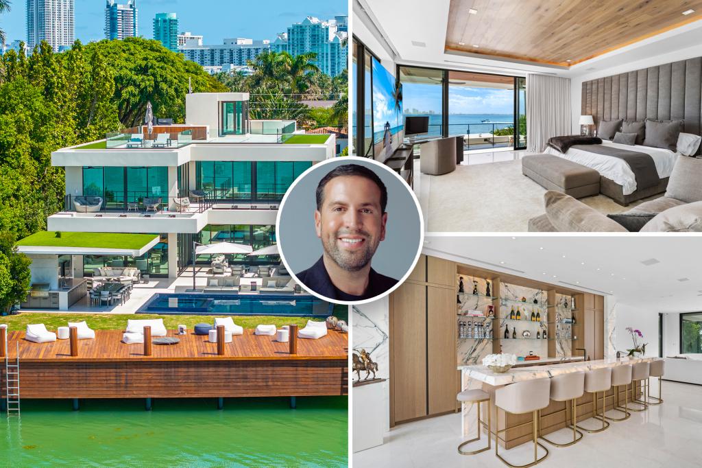 The owner of LA's largest mansion buys two Miami Beach homes on the same street as David Beckham in a $30 million cash deal.