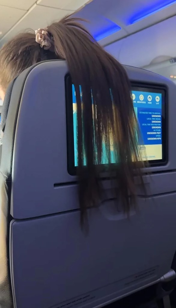 Hair draped over the man's screen.